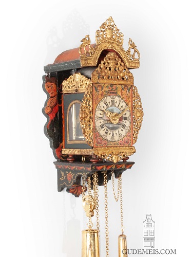 A miniature Dutch Frisian polychrome striking and alarm 'little skipper' wall clock, circa 1800.
